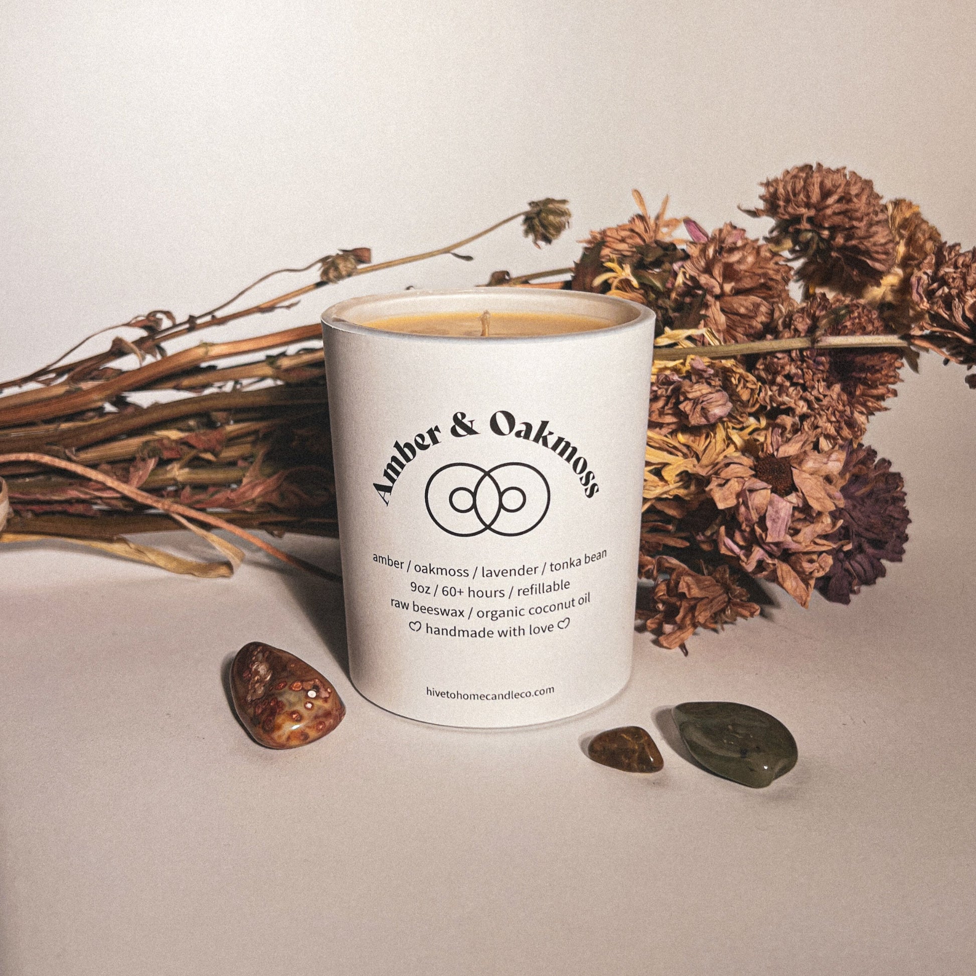 Amber and oakmoss scented beeswax candle image, Aesthetic beeswax and dried flowers.