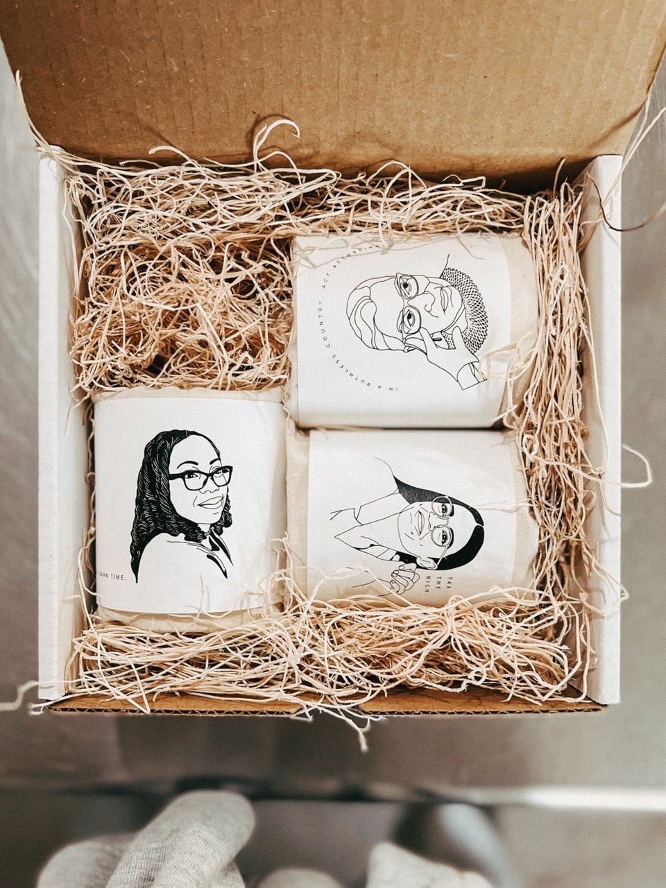 Feminist Powerful Women Ruth Bader Ginsburg candle RBG in a ruthless country act accordingly candle outer packing image