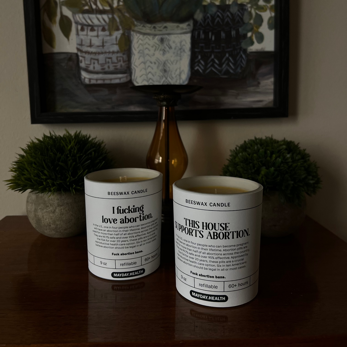 Mayday Health and Hive To Home Candle Co's "I fucking love abortion" and "This house supports abortion" candles.