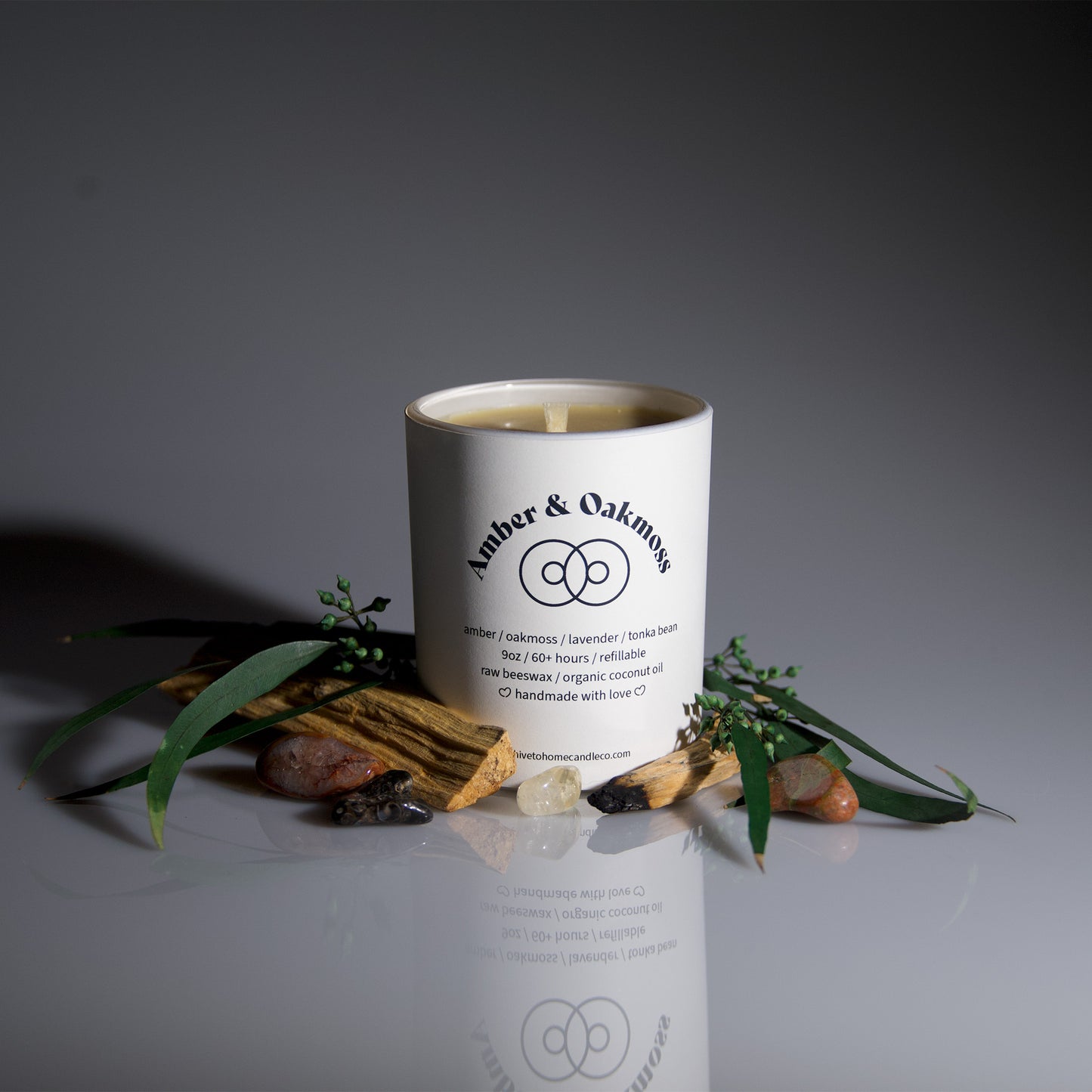 Scented Beeswax candle with notes of amber, oak moss, lavender, and tonka bean. Perfect 9 oz. white tumbler jar.