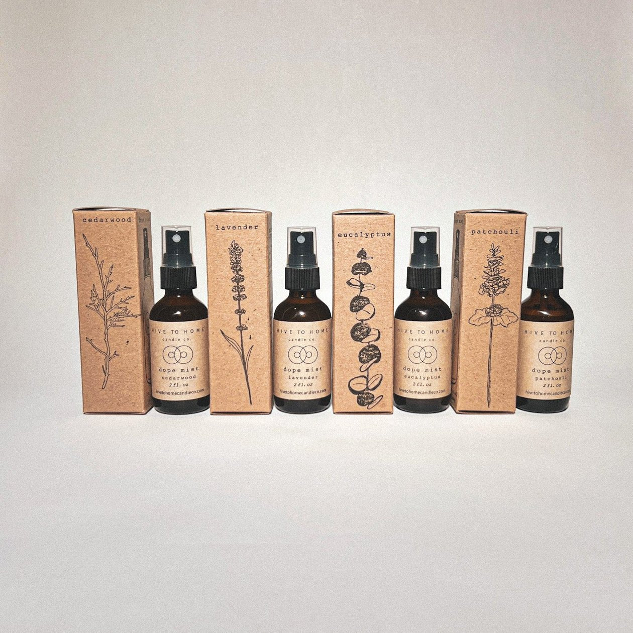 Dope Mist Bundle image, 2 oz scent spray bottles and hand-stamped boxes with cedar wood, lavender, eucalyptus, & patchouli line art. 