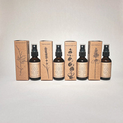 Dope Mist Bundle image, 2 oz scent spray bottles and hand-stamped boxes with cedar wood, lavender, eucalyptus, & patchouli line art. 
