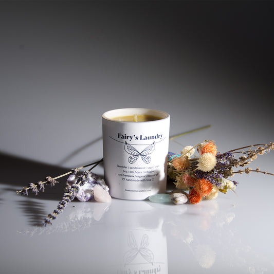 Fairy's Laundry lavender, sandalwood, sage, and linen scented beeswax candle. 