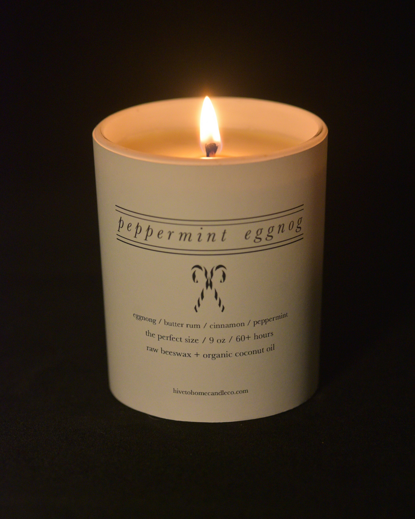 image of a festive candle, candy cane line art peppermint eggnog scented candle.