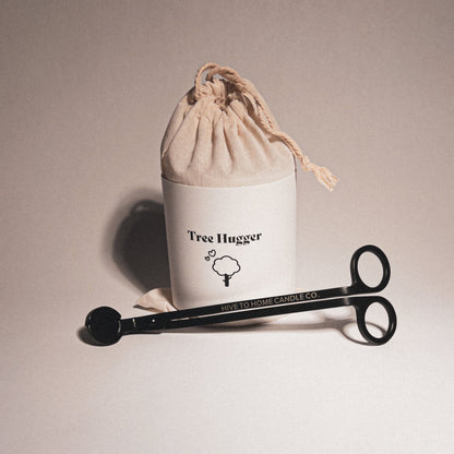 Cedar & Pine candle outer packaging with candle wick trimmer.