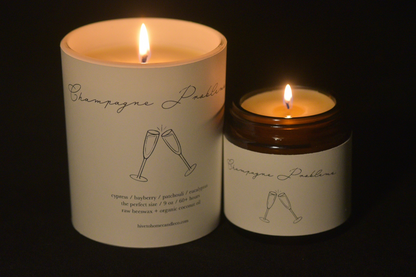 Champagne Problems toasting candle cover image 9 oz white tumbler and 4 oz amber candles.