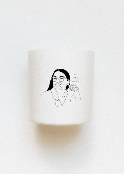 Feminist candle AOC Alexandria Ocasio-Cortez "tax the rich" scented beeswax candle from Hive To Home Candle Co. The perfect candle is refillable